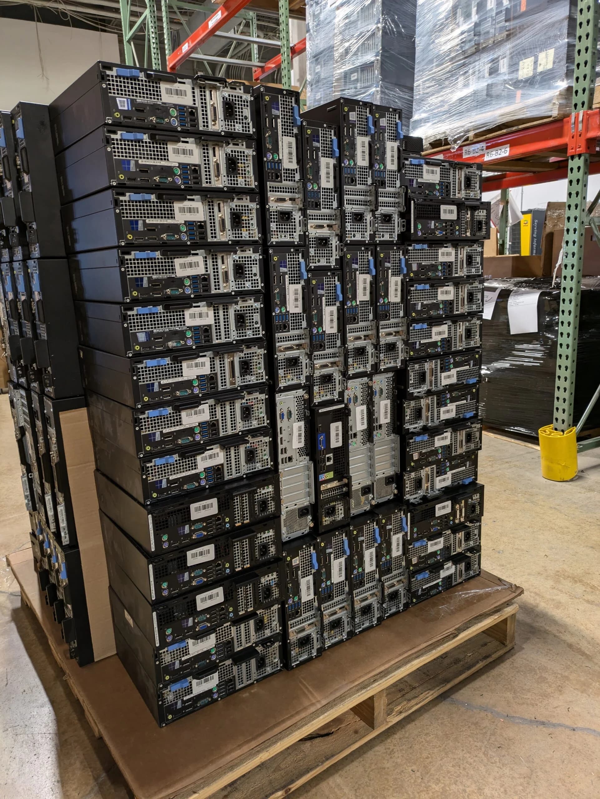 A pallet of desktop computers stacked for pickup