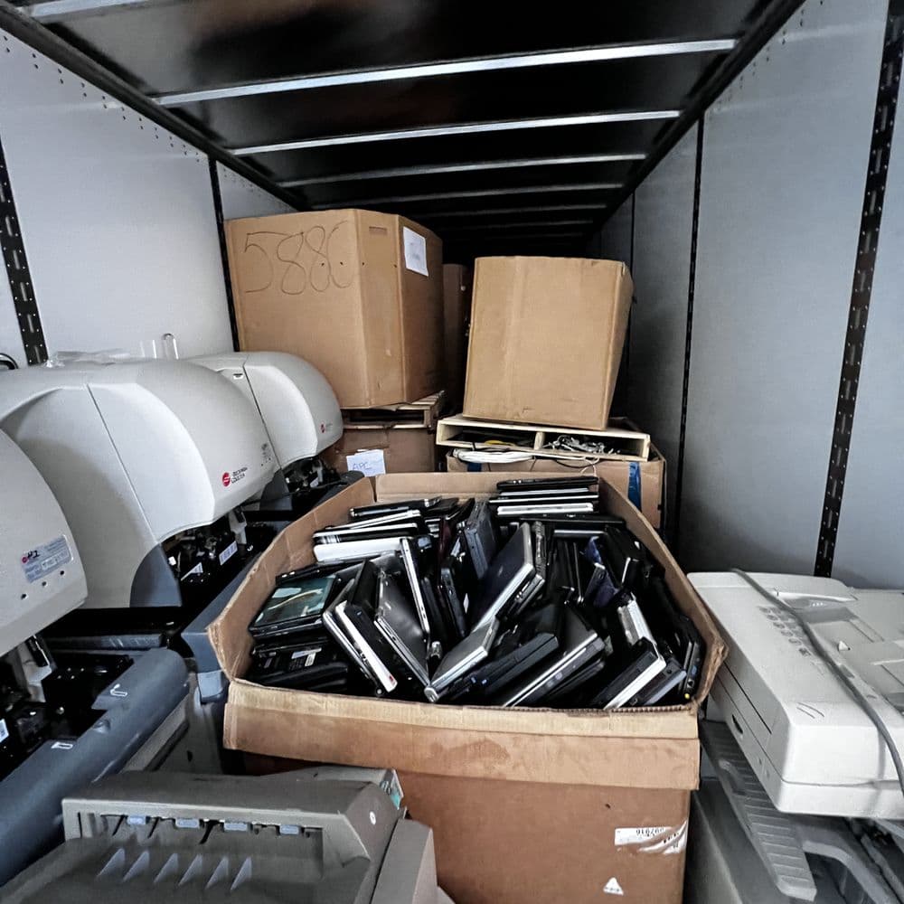 Laptops and office equipment loaded in the truck
